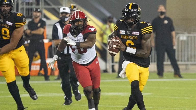 Hamilton Tiger-Cats quarterback David Watford (6) scrambles during first half CFL football game action against the Calgary Stampeders in Hamilton, Ont. on Friday, September 17, 2021. (Peter Power/CP)