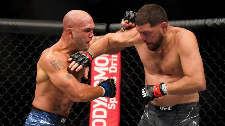 Robbie Lawler, left, throws a punch against Nick Diaz during a middleweight mixed martial arts bout at UFC 266, Saturday, Sept. 25, 2021, in Las Vegas (John Locher/AP).
