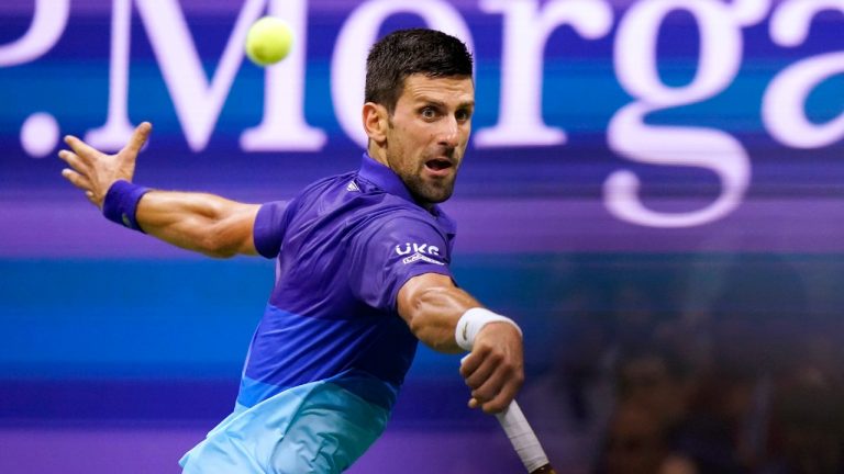 Novak Djokovic hits a return to Matteo Berrettini during the quarterfinals of the U.S. Open. (Frank Franklin II/AP)