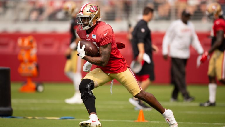 San Francisco 49ers running back Raheem Mostert (31) runs out a pass play during an NFL football open practice, Saturday, Aug. 7, 2021, in Santa Clara, Calif (D. Ross Cameron/AP).