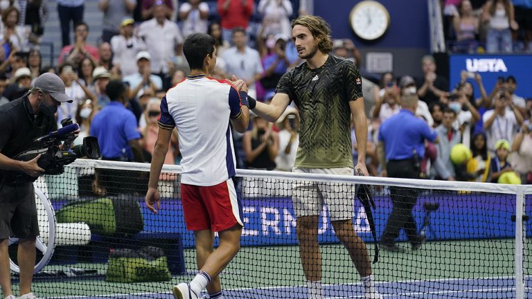 Carlos Alcaraz, left, of Spain, shakes hands with defeating Stefanos Tsitsipas, of Greece, after defeating Tsitsipas during their third round match of the US Open tennis championships, Friday, Sept. 3, 2021, in New York. (Seth Wenig/AP)
