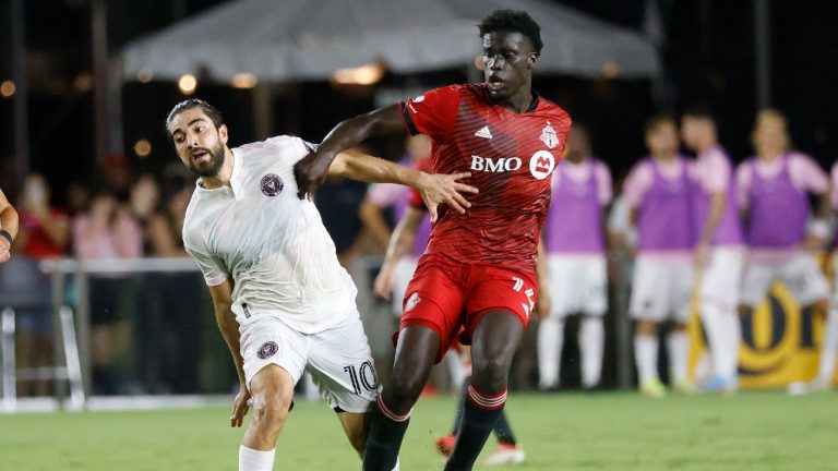 Toronto FC midfielder Noble Okello (14) and Inter Miami midfielder Rodolfo Pizarro (10) fight for the ball during the second half of an MLS soccer match Saturday, Aug. 21, 2021, in Fort Lauderdale, Fla (Rhona Wise/AP).