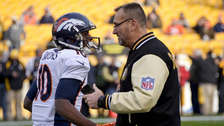 Denver Broncos wide receiver Emmanuel Sanders (10) talks with former Pittsburgh Steelers lineman Tunch Ilkin before an NFL football game in Pittsburgh. (Don Wright/AP)