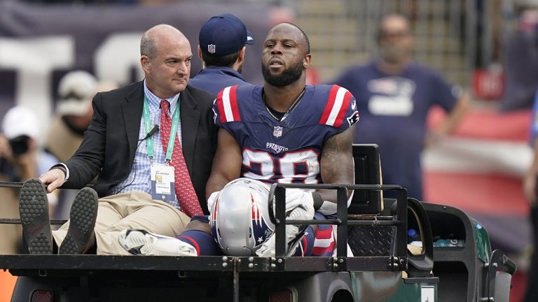 New England Patriots running back James White (28) is carted off the field after an apparent injury during the first half of an NFL football game against the New Orleans Saints, Sunday, Sept. 26, 2021, in Foxborough, Mass. (Steven Senne/AP)
