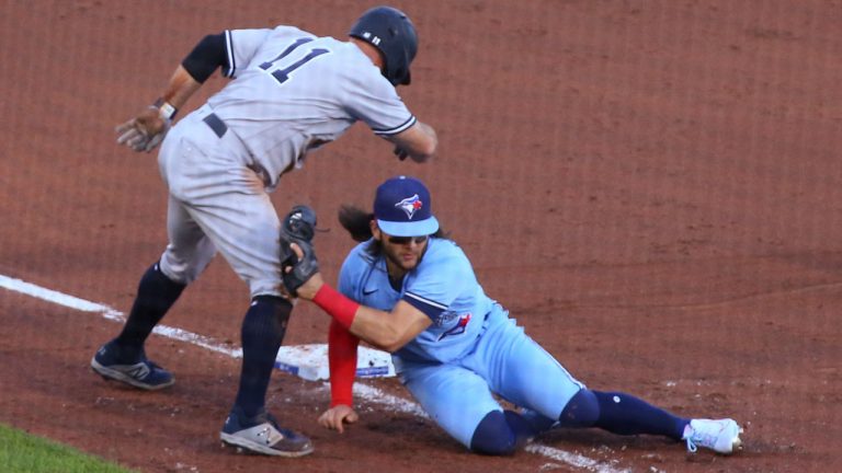 Toronto Blue Jays shortstop Bo Bichette tags out New York Yankees' Brett Gardner at third during the second inning of a baseball game. (Jeffrey T. Barnes/AP)