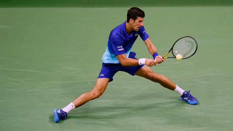 Novak Djokovic, of Serbia, returns a shot to during the first round of the US Open tennis championships, Tuesday, Aug. 31, 2021, in New York. (Frank Franklin II/AP) 
