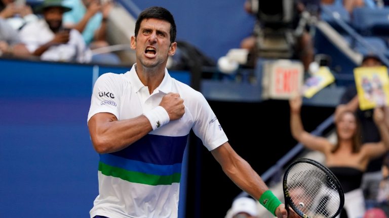 Novak Djokovic, of Serbia, reacts after scoring a point against Kei Nishikori, of Japan, during the third round of the US Open tennis championships, Saturday, Sept. 4, 2021, in New York. (John Minchillo/AP)