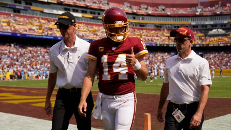 Washington Football Team quarterback Ryan Fitzpatrick (14) gives a 'thumbs-up' as he walks off field after being injured during the first half of an NFL football game against the Los Angeles Chargers, Sunday, Sept. 12, 2021, in Landover, Md. (Andrew Harnik/AP)