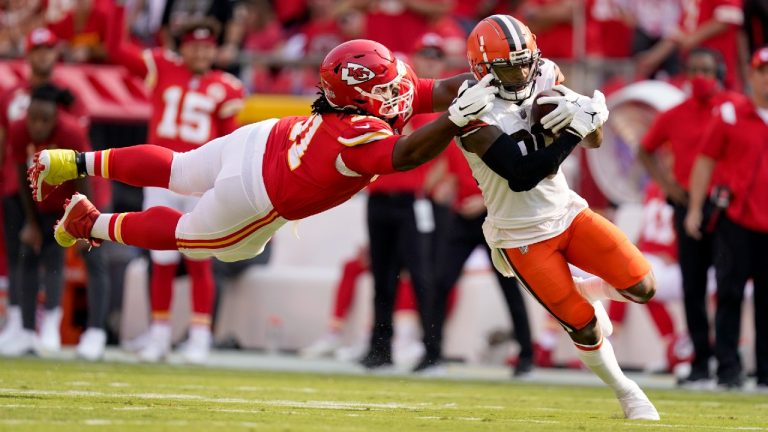 Cleveland Browns wide receiver Jarvis Landry, right, runs with the ball as Kansas City Chiefs defensive tackle Derrick Nnadi defends during the first half of an NFL football game Sunday, Sept. 12, 2021, in Kansas City, Mo. (Charlie Riedel/AP)
