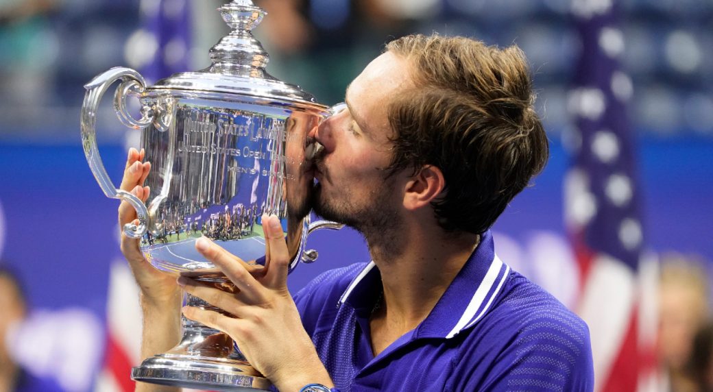 Daniil Medvedev of Russia, right, poses after winning the final