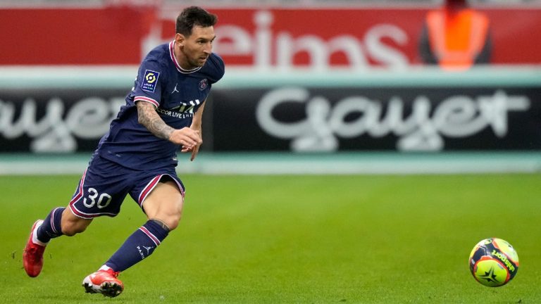 PSG's Lionel Messi in action during the France League One soccer match between Reims and Paris Saint-Germain, at the Stade Auguste-Delaune in Reims. (Francois Mori/AP)