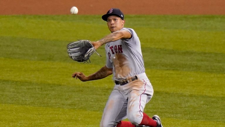 Boston Red Sox's Yairo Munoz catches a fly ball hit by Miami Marlins' Garrett Cooper during the third inning of a baseball game, Wednesday, Sept. 16, 2020, in Miami. (Lynne Sladky/AP)