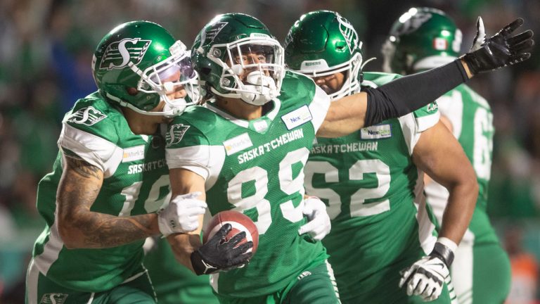 Saskatchewan Roughriders wide receiver Kian Schaffer-Baker (89) celebrates his touchdown against the Toronto Argonauts with teammate Brayden Lenius (19) during the second half of CFL football action. (Kayle Neis/CP)