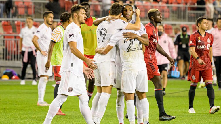 Inter Miami forward Federico Higuain (22), forward Robbie Robinson (19) and defender Christian Makoun (4) celebrate after defeating Toronto FC in extra minutes of MLS action. (Christopher Katsarov/CP)