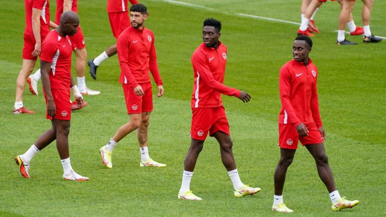 Kamal Miller, left to right, Jonathan Osorio, Alphonso Davies and Richie Laryea of the Canada men's national soccer team train in Toronto on Tuesday, October 12, 2021. Canada plays Panama in a 2022 FIFA World Cup qualification match in Toronto on Wednesday. (Evan Buhler/CP)