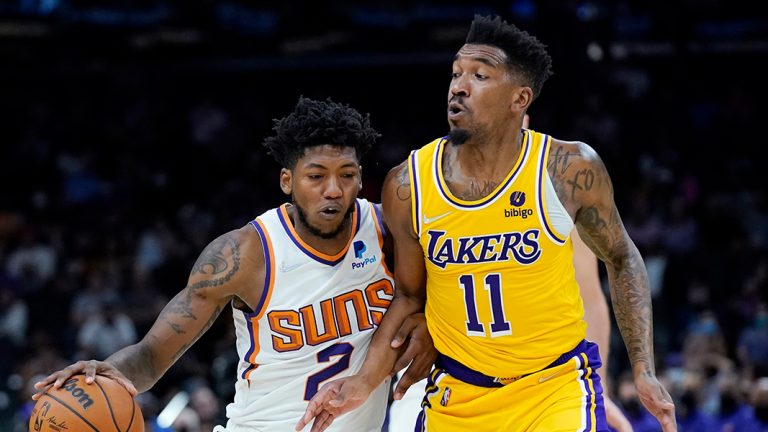 Phoenix Suns guard Elfrid Payton (2) collides with Los Angeles Lakers guard Malik Monk (11) during the second half of a preseason NBA basketball game Wednesday, Oct. 6, 2021, in Phoenix. (Ross D. Franklin/AP)