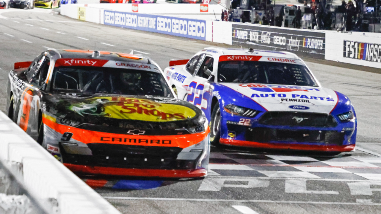 Noah Gragson crosses the finish line ahead of Austin Cindric to win a NASCAR Xfinity Series auto race on Saturday at Martinsville. (AP)