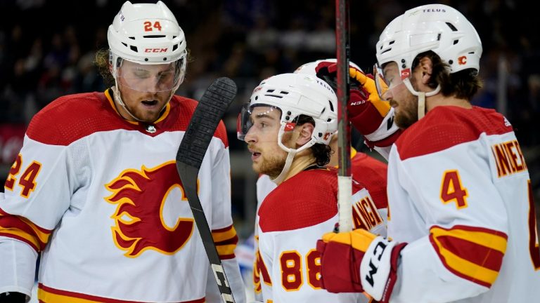 Calgary Flames left wing Andrew Mangiapane (88) celebrates with teammates after scoring against New York Rangers goaltender Igor Shesterkin during the second period of an NHL hockey game, Monday, Oct. 25, 2021, in New York (John Minchillo/AP).