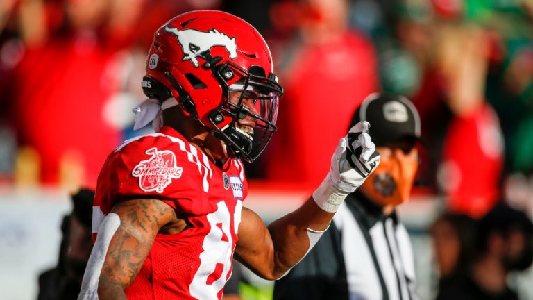 Calgary Stampeders' Malik Henry celebrates his touchdown during first half CFL football action against the Saskatchewan Roughriders in Calgary, Saturday, Oct. 2, 2021 (Jeff McIntosh/CP).