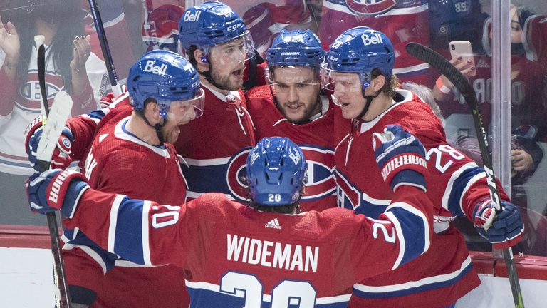 Montreal Canadiens Jonathan Drouin (92) celebrates with teammates after scoring against the New York Rangers during third period NHL hockey action in Montreal, Saturday, October 16, 2021. (Graham Hughes/CP)