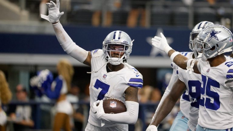 Dallas Cowboys cornerback Trevon Diggs (7), Nahshon Wright (25) and others celebrate Diggs intercepting a Carolina Panthers' Sam Darnold pass. (Ron Jenkins/AP)