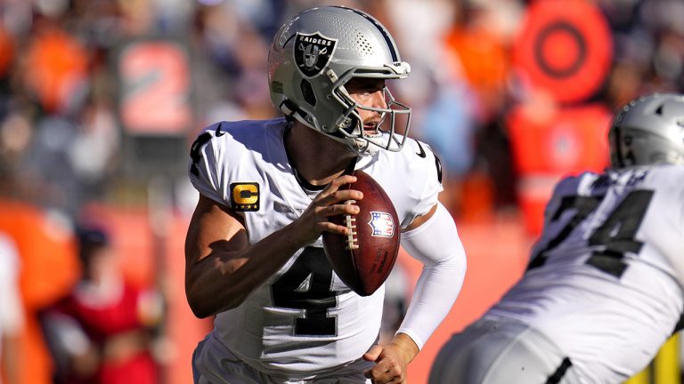Las Vegas Raiders quarterback Derek Carr (4) looks to throw against the Denver Broncos during the first half of an NFL football game, Sunday, Oct. 17, 2021, in Denver. (Jack Dempsey/AP)