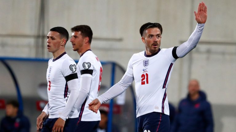 England's Jack Grealish, right, celebrates after scoring his side's fifth goal during the World Cup 2022 group I qualifying soccer match between Andorra and England at the National Stadium in Andorra la Vella, Saturday, Oct. 9, 2021 (Joan Monfort/AP).