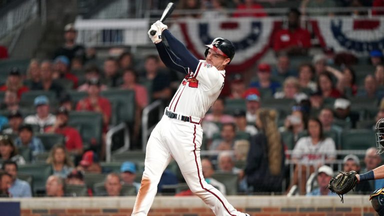 Atlanta Braves' Freddie Freeman (5) hits a single against the Milwaukee Brewers during the sixth inning of Game 4 of a baseball National League Division Series, Tuesday, Oct. 12, 2021, in Atlanta. (Brynn Anderson/AP)