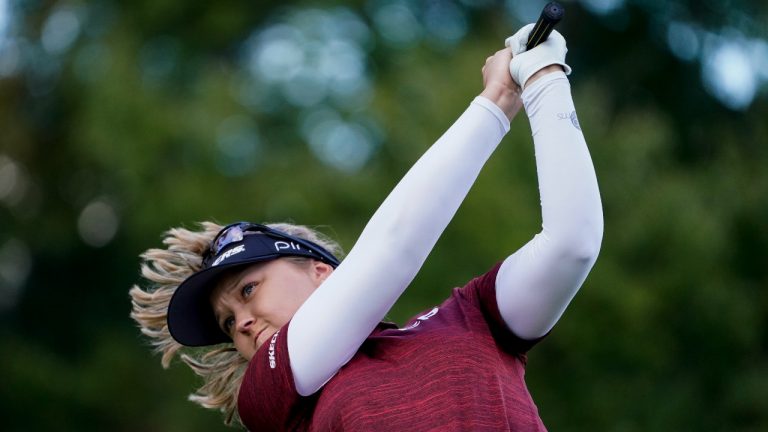 Brooke M. Henderson, of Canada, hits off the third tee in the first round of the Cognizant Founders Cup LPGA golf tournament, Thursday, Oct. 7, 2021, in West Caldwell, N.J. (John Minchillo/AP Photo) 
