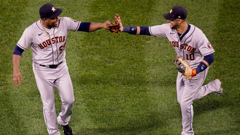 Houston Astros starting pitcher Framber Valdez celebrates the end of the seventh inning with first baseman Yuli Gurriel against the Boston Red Sox in Game 5 of baseball's American League Championship Series Wednesday, Oct. 20, 2021, in Boston. (Charles Krupa/AP)