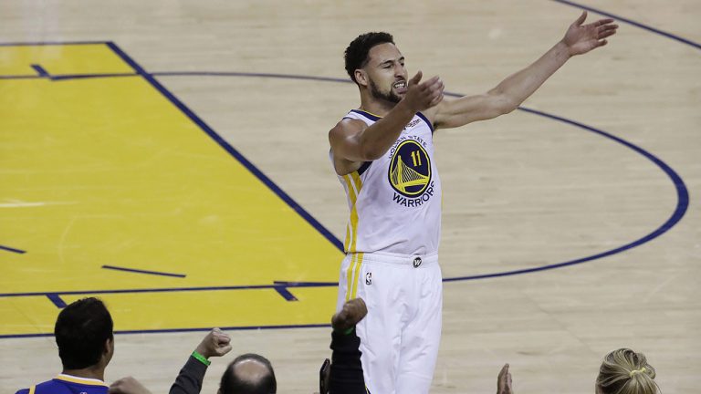 Golden State Warriors guard Klay Thompson (11) celebrates with fans after scoring against the Portland Trail Blazers during the second half of Game 1 of the NBA basketball playoffs Western Conference finals. (Jeff Chiu/AP)