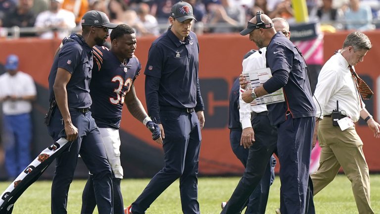 Chicago Bears head coach Matt Nagy, right, looks at running back David Montgomery (32) as he leaves the field after being injured during the second half of an NFL football game against the Detroit Lions Sunday, Oct. 3, 2021, in Chicago. (Nam Y. Huh/AP)