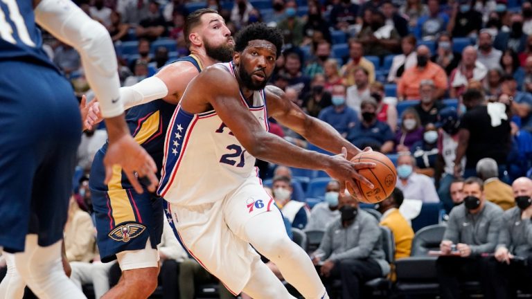 Philadelphia 76ers center Joel Embiid (21) drives to the basket against New Orleans Pelicans center Jonas Valanciunas in the first half of an NBA basketball game in New Orleans, Wednesday, Oct. 20, 2021. (Gerald Herbert/AP)