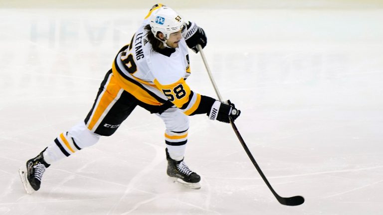 Pittsburgh Penguins defenseman Kris Letang (58) shoots during the third period of an NHL hockey game against the New Jersey Devils, Sunday, April 11, 2021, in Newark, N.J. (Kathy Willens/AP)