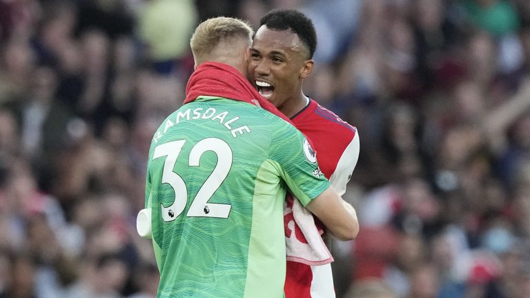 Arsenal's Gabriel, right, celebrates with Arsenal's goalkeeper Aaron Ramsdale at the end of the English Premier League soccer match between Arsenal and Tottenham Hotspur at the Emirates stadium in London. (Frank Augstein/AP)