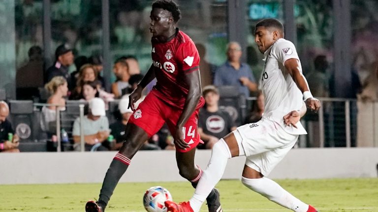 Toronto FC midfielder Noble Okello (14) and Inter Miami defender Christian Makoun, right, go for the ball during the second half of an MLS soccer match, Wednesday, Oct. 20, 2021, in Fort Lauderdale, Fla. Inter Miami won 3-0 (Lynne Sladky/AP).