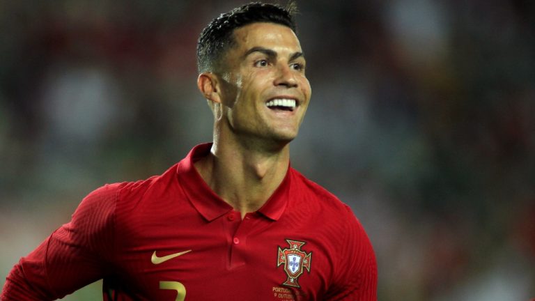 Portugal's Cristiano Ronaldo smiles after scoring the opening goal during the international friendly soccer match between Portugal and Qatar at the Algarve stadium outside Faro, Portugal, Saturday, Oct. 9, 2021 (Joao Matos/AP).