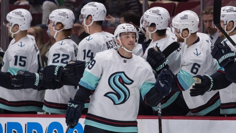 Seattle Kraken's Vince Dunn (29) celebrates his first goal against the Vancouver Canucks during the second period of a pre-season NHL hockey game in Vancouver, on Tuesday, October 5, 2021. (Darryl Dyck/CP)