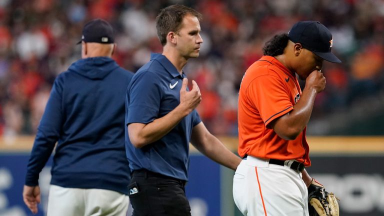 Houston Astros starting pitcher Luis Garcia leaves the games against the Boston Red Sox during the second inning in Game 2 of baseball's American League Championship Series Saturday. (Tony Gutierrez/AP) 