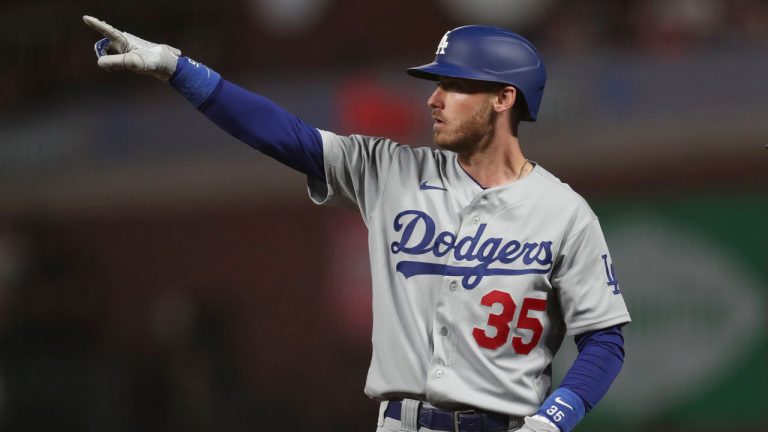 Los Angeles Dodgers' Cody Bellinger gestures after hitting an RBI-single against the San Francisco Giants during the ninth inning of Game 5 of a baseball National League Division Series. (Jed Jacobsohn/AP)