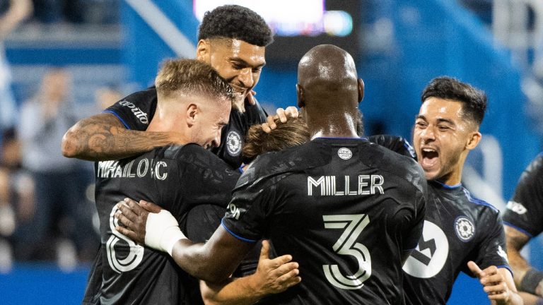 CF Montreal players celebrate a goal. (Graham Hughes/CP)