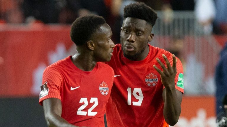 Canada's Alphonso Davies (right) speaks with teammate Richie Laryea after the final whistle following their 4-1 win over Panama in World Cup Qualifying action. (Chris Young/CP)