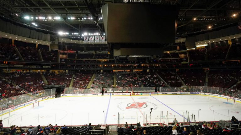 Fans wait for an NHL preseason hockey game between the New Jersey Devils and the New York Islanders. The game was delayed due to a power outage at the Prudential Center. (Frank Franklin II/AP)