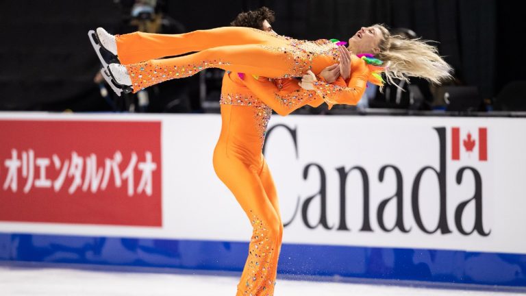 Canada's Piper Gilles and Paul Poirier perform their ice dance rhythm dance routine at the Skate Canada International figure skating competition, in Vancouver, on Friday, October 29, 2021. (Darryl Dyck/CP)
