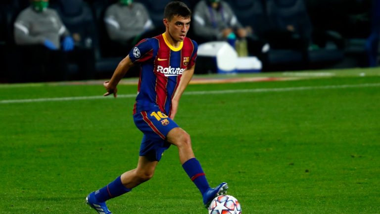 In this Oct. 20, 2020 file photo, Barcelona's Pedri controls the ball during the Champions League group G soccer match between FC Barcelona and Ferencvaros at the Camp Nou stadium in Barcelona. Barcelona has re-signed Pedri Gonzalez to a new contract through the 2025-26 season. The 18-year-old midfielder is one of the few bright spots in an otherwise tumultuous period for the Spanish club. (Joan Monfort/AP)