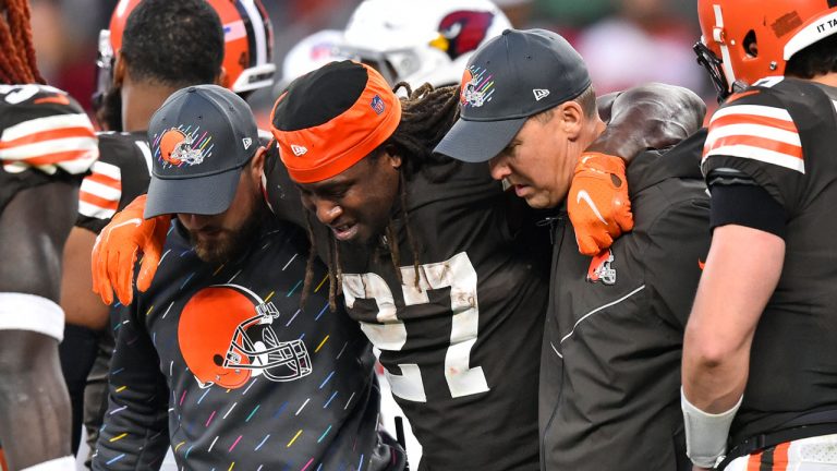 Cleveland Browns running back Kareem Hunt (27) is helped off the field after an injury during the second half of an NFL football game against the Arizona Cardinals. (David Richard/AP) 
