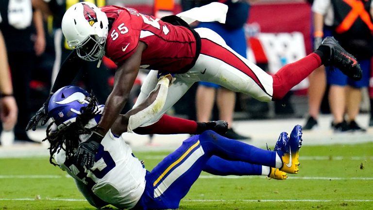 Arizona Cardinals linebacker Chandler Jones (55) hits Minnesota Vikings running back Dalvin Cook (33) during the second half of an NFL football game, Sunday, Sept. 19, 2021, in Glendale, Ariz. (Ross D. Franklin/AP)