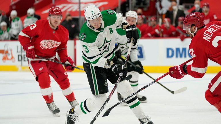 Dallas Stars defenseman John Klingberg (3) takes a slap shot as Detroit Red Wings defenseman Patrik Nemeth (22) defends during the first period of an NHL hockey game. (Carlos Osorio/AP)