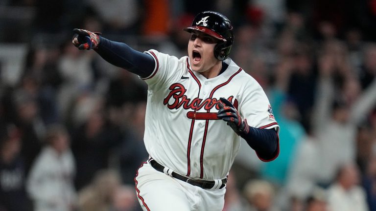 Atlanta Braves' Austin Riley reacts after hitting the game winning RBI single to score Atlanta Braves' Ozzie Albies in the ninth inning in Game 1 of baseball's National League Championship Series against the Los Angeles Dodgers Saturday, Oct. 16, 2021, in Atlanta. The Braves defeated the Dodgers 3-2 to take game 1. (Ashley Landis/AP)