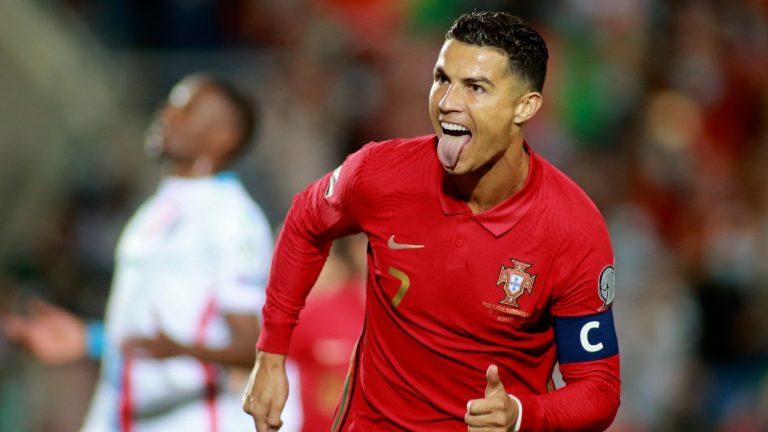 Portugal's Cristiano Ronaldo celebrates after scoring his side's second goal from the penalty spot during the World Cup 2022 group A qualifying soccer match between Portugal and Luxembourg at the Algarve stadium outside Faro, Portugal, Tuesday, Oct. 12, 2021. (Joao Matos/AP)